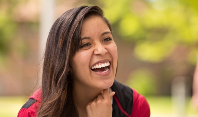 Angie Jimenez ’14 will walk across the Tacoma Dome stage as she graduates from Pacific Lutheran University on May 24, grateful for the support of her parents, Dale Benson and the Minds Matter program. (Photo: John Froschauer/PLU)