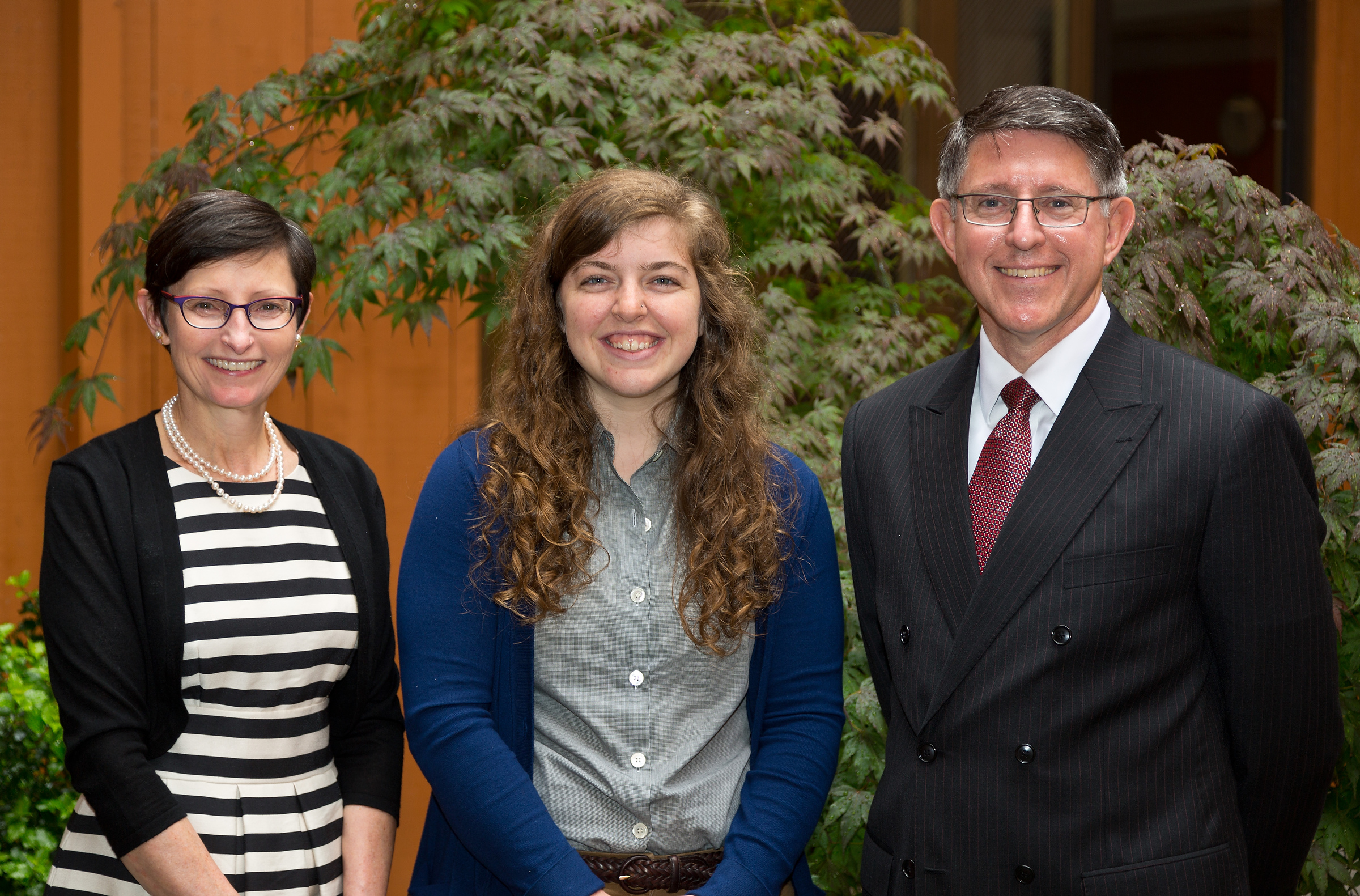 PLU President Thomas W. Krise, right, and Patricia L. Krise, left, pose with Emily Ames, the first recipient of the Krises’ endowed internship. (Photo: John Froschauer/PLU)