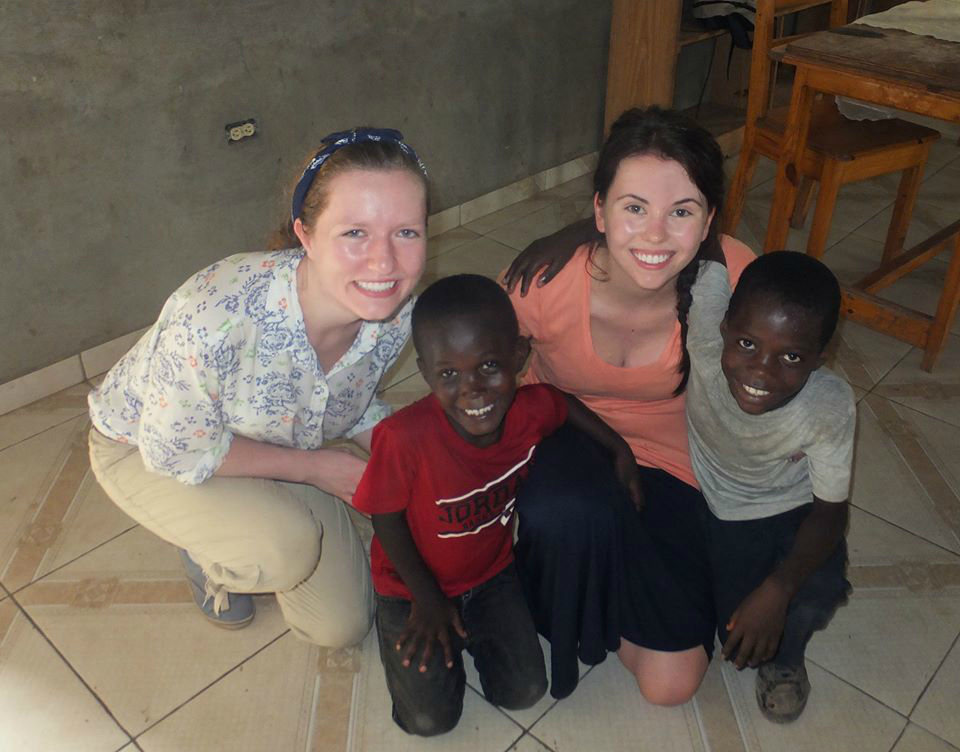 PLU Nursing students Madison Gatterman, left, and Sarah Jamieson taught basic healthcare and dental hygiene to young children at a Haitian orphanage. (Photo courtesy of Gatterman and Jamieson)