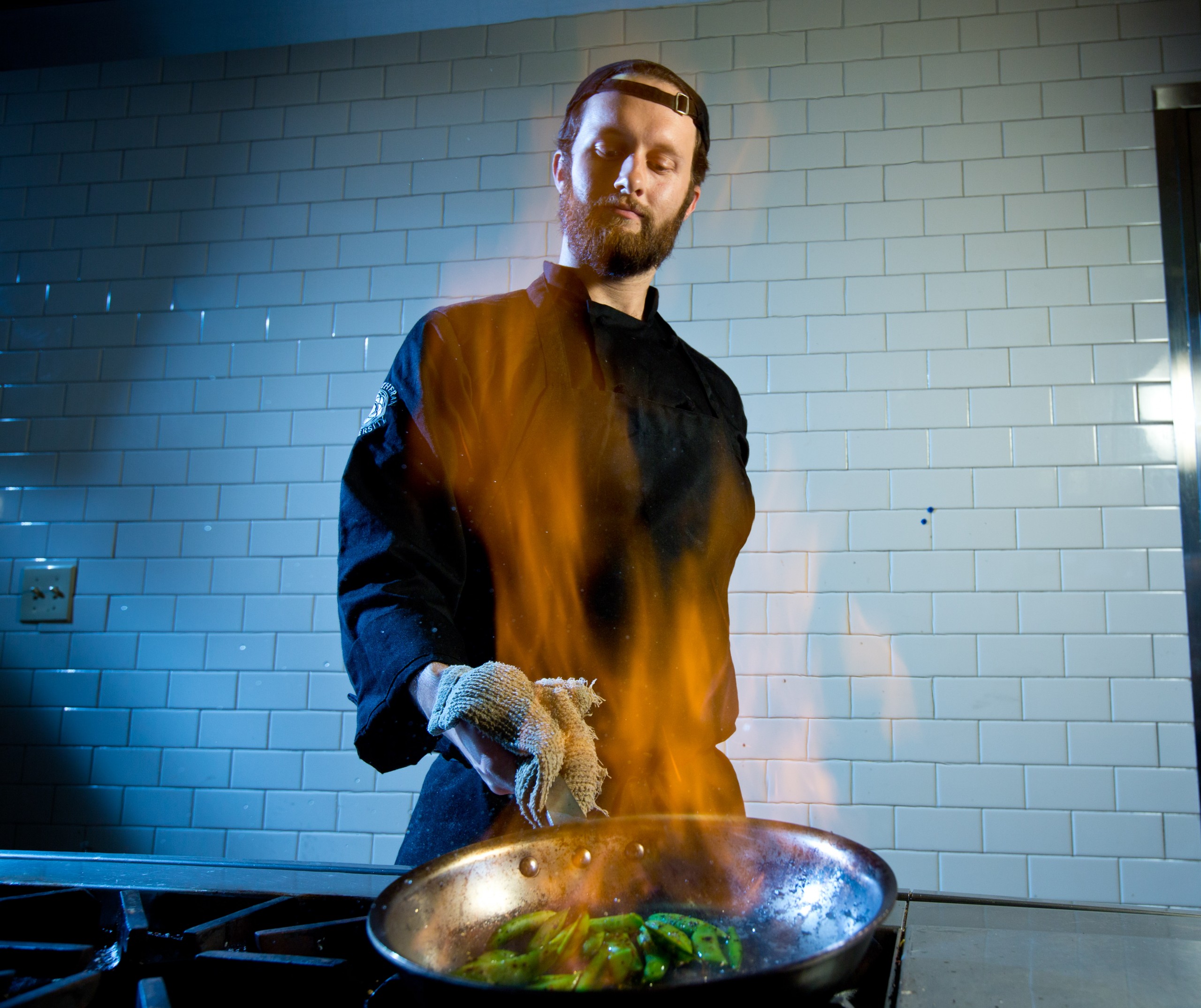 Jason Sipe, an MBA student and line cook at the Anderson University Center, has been selected to compete in the first-ever ment’or Young Chef Competition. (Photo: John Froschauer/PLU)