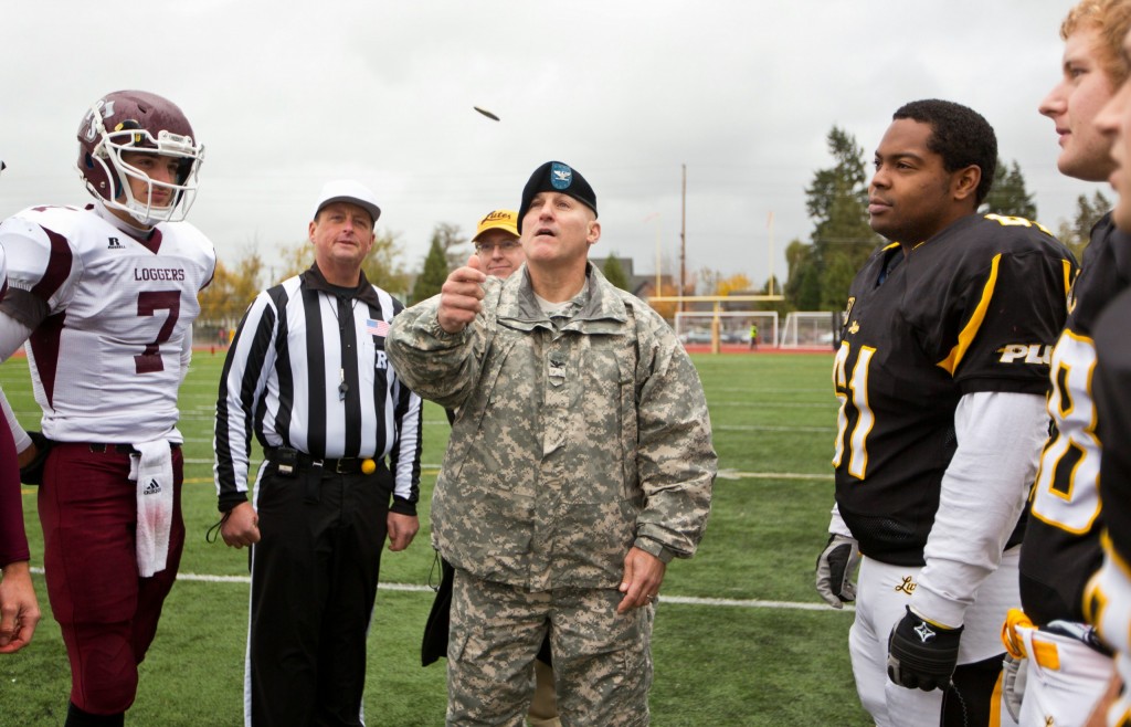 A Month of Veterans Day Events at PLU Coin flip at the beginning of a football game