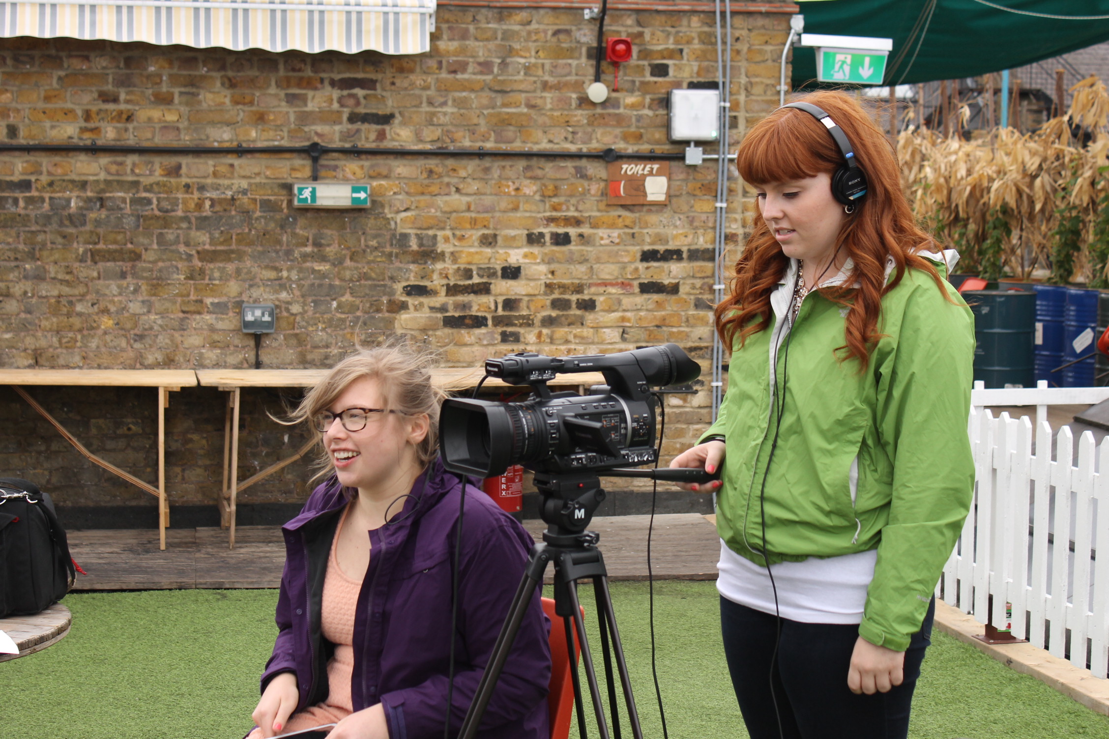 MediaLab member Olivia Ash, left, conducts an interview in London while Taylor Lunka operates the camera. (Photo courtesy of MediaLab)