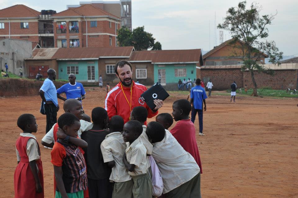 Croft works with children in Uganda as part of PlayUp, his former nonprofit. (Photo courtesy of Andrew Croft)