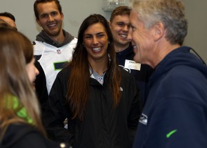From left, Chelsea Miller, Kevin De Jong, Lauren McClung and Jordan Zepernick share a laugh with Carroll. (Photo: Corky Trewin/Seattle Seahawks)