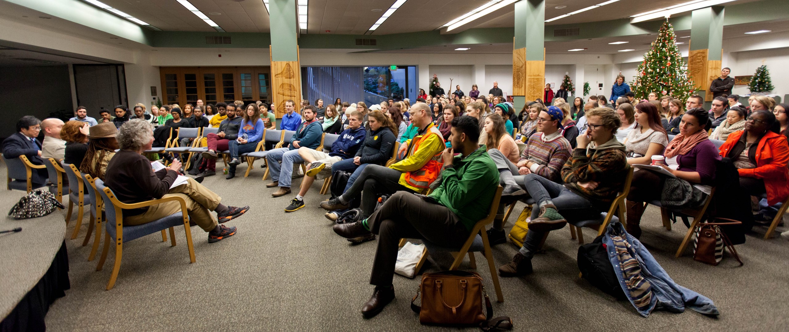 forum at PLU on Dec. 4 called #BlackLivesMatter addressed issues surrounding the deaths of African Americans by police. The forum, attended by more than 250 students and members of PLU faculty, staff and community, was sponsored by the Diversity Center, the Women’s Center and the Center for Community Engagement and Service and was held in the Scandinavian Cultural Center. (Photo: John Froschauer/PLU) Photo of the speakers and audience.