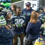 Seattle Seahawks events set up and staged by 2014 MBA graduate Stephen Dilts’ company, Pyramid Staging & Events, LLC. (Photos courtesy John Patzer Photography. Blitz and a Seahawk football player handing out things.