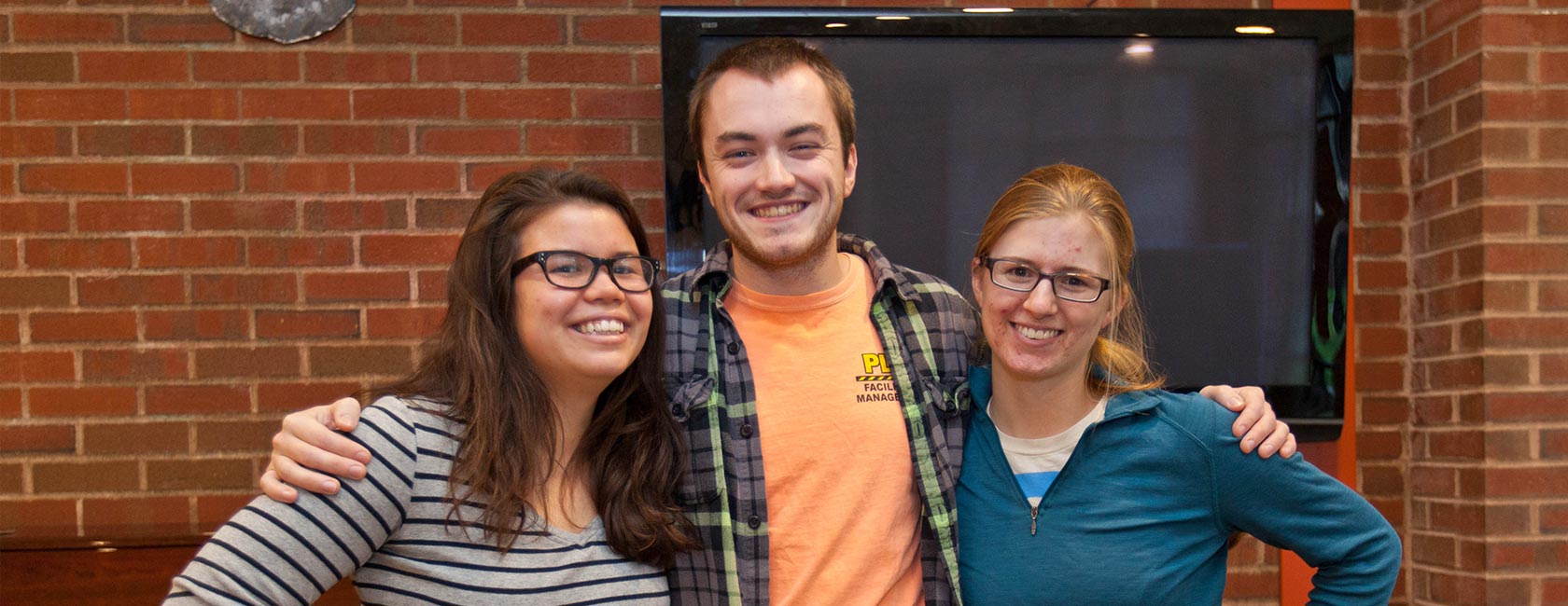 From left: Aiko Nakagawa '15, Neil Wagner '15 and Ashley Connors '17 presented their research project to PSE officials. (Photo: John Froschauer/PLU)