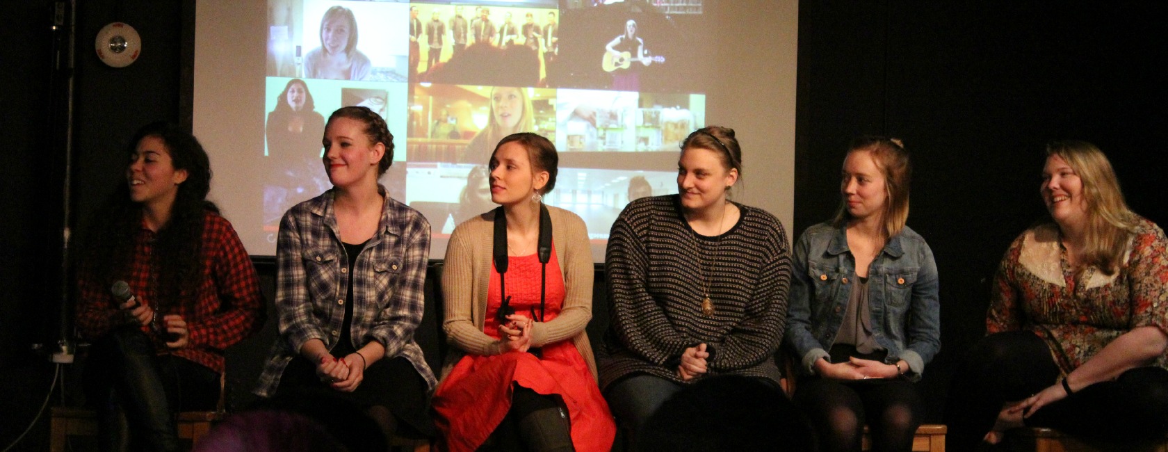 The cast and crew of the CMS student television show "Dear Emily" take the stage at a January kickoff party in The Cave. (Photo: Center for Media Studies)