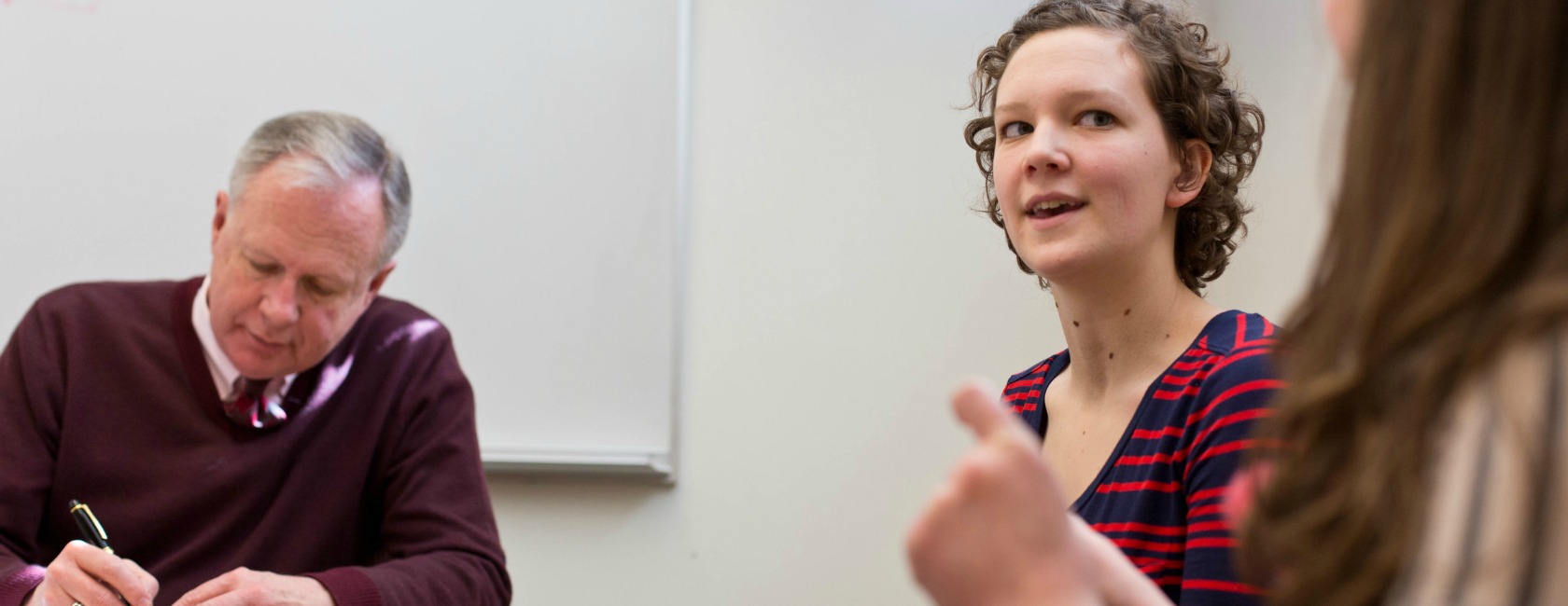 Director of Vocational Reflection Samuel Torvend meets with one of this year's Wild Hope Fellows, Hannah Anderson '15. (Photo: John Froschauer/PLU)