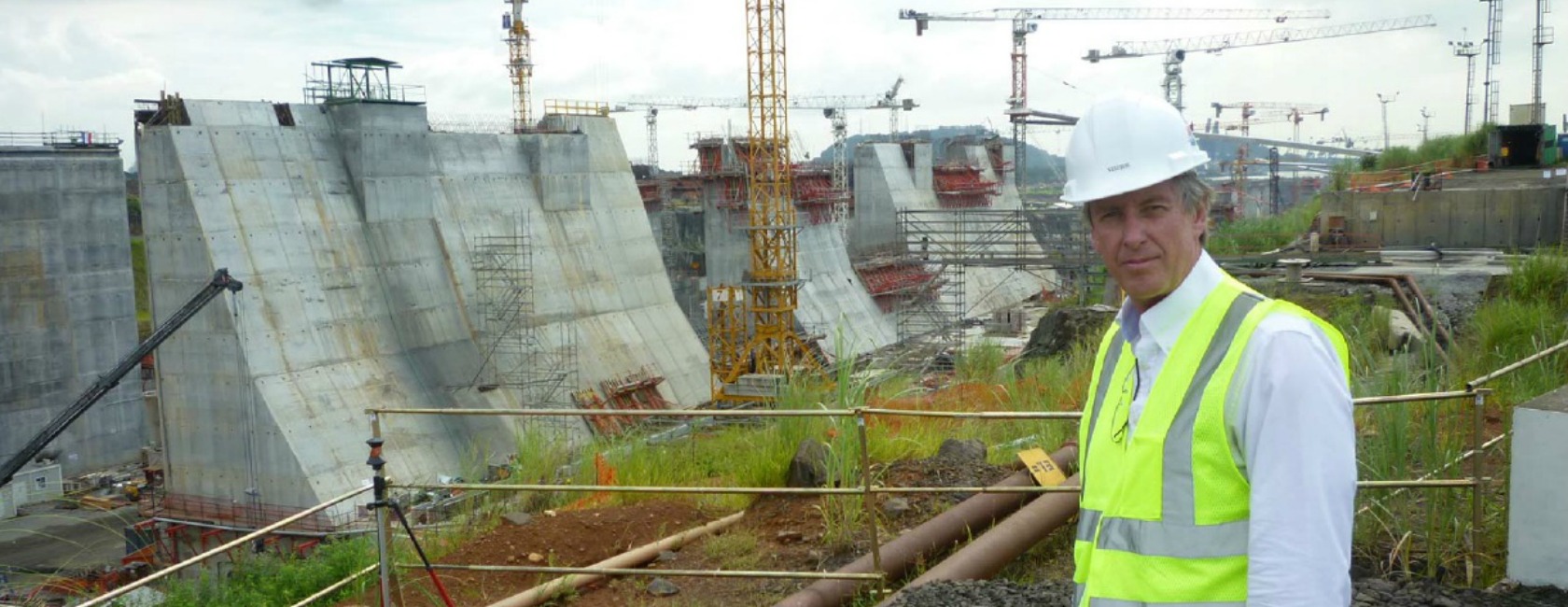 Alan Krause '76 stands in front of the construction site at the Panama Canal expansion. (Photo courtesy of MWH Global)