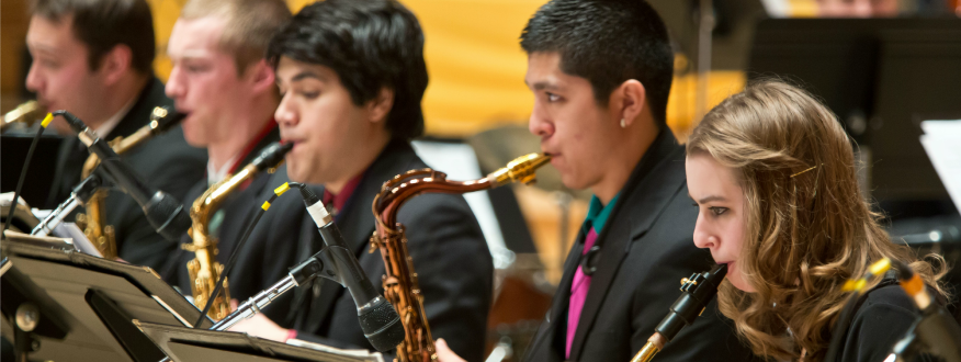 Student playing saxophones