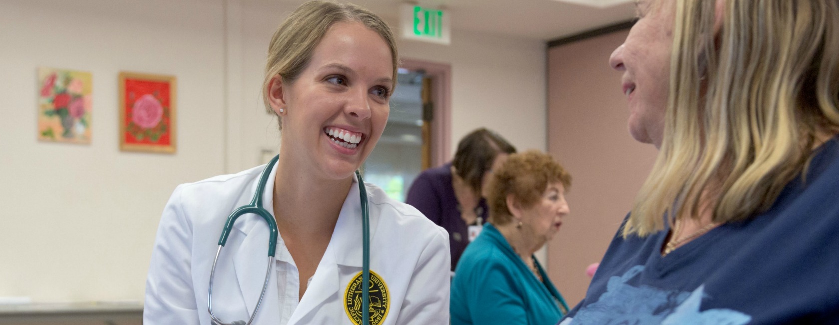 A PLU Nurse Practitioner student works during a health-outreach activity at the Sumner Senior Center. (Photo: John Froschauer/PLU)