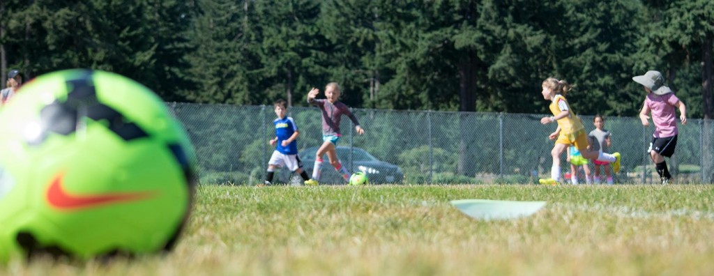 Young people play soccer at Colleen Hacker's Success Soccer Camp.