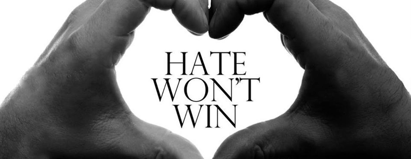 Hands making a heart with the word Hate Won't Win in the middle