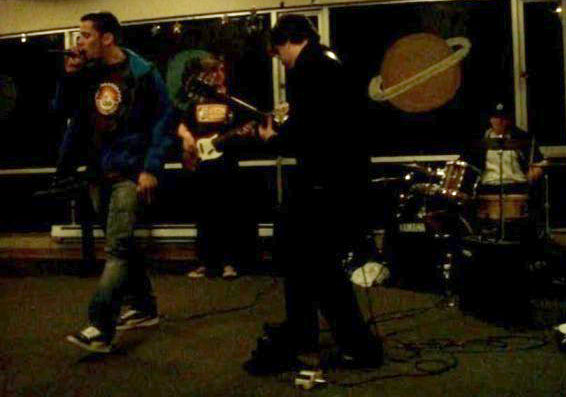 The author and his band, 10th & Commerce, perform for the first time for friends in the lobby of Foss Hall in 2007.