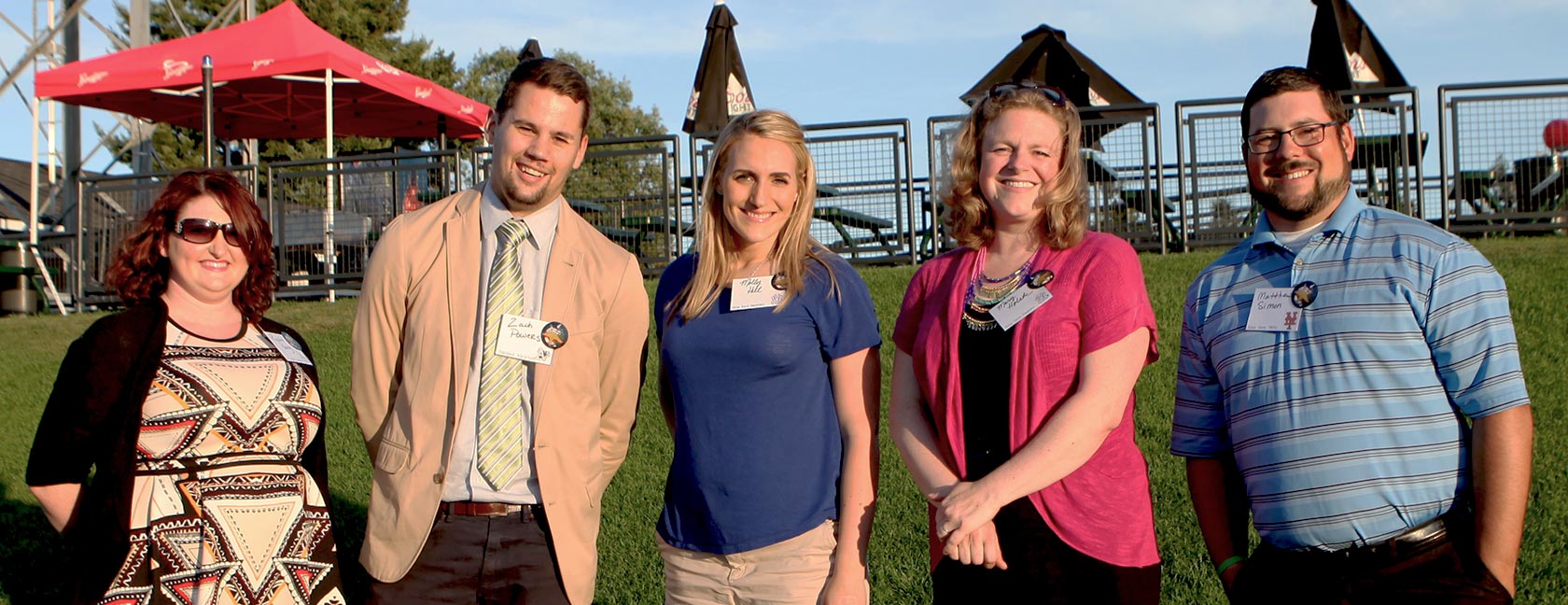 The five Lutes honored on the Business Examiner's '40 Under 40' list, from left: Rachel Young '06, '13; Zach Powers '10; , Molly Hill '05; Mary Holste '00; and Matthew Simon '03. (Photo: Holly Powers)