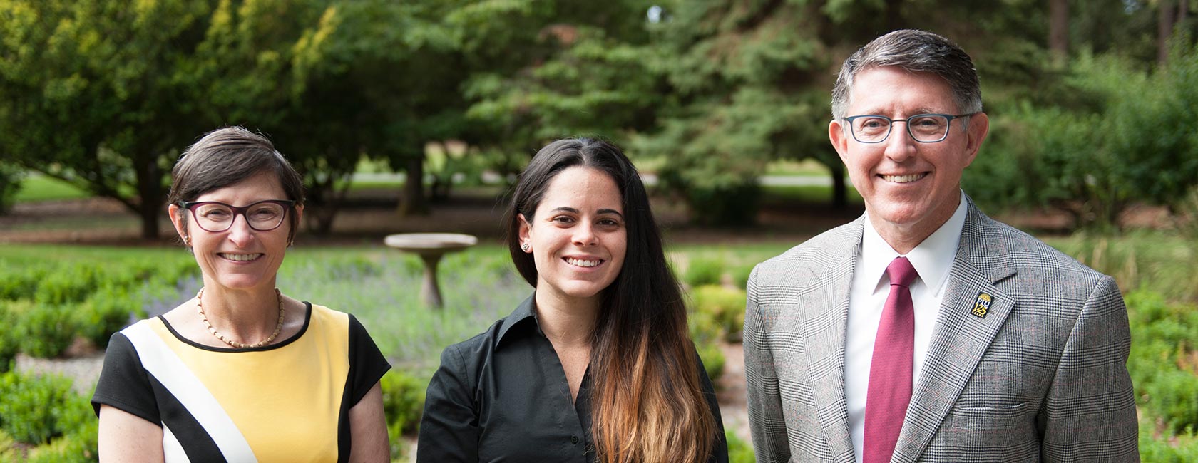 Patricia Krise, Jessica Milian '15 and PLU President Thomas W Krise at the Gonyea House. [Photo by John Struzenberg '16/PLU]