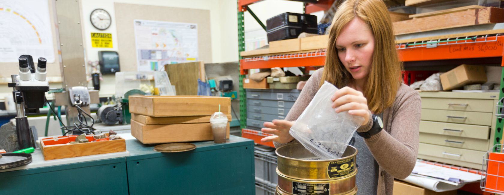 Samantha Harrison ’16 works in PLU’s Geoscience lab with samples collected from Mount Rainier. (Photo: John Froschauer: PLU)