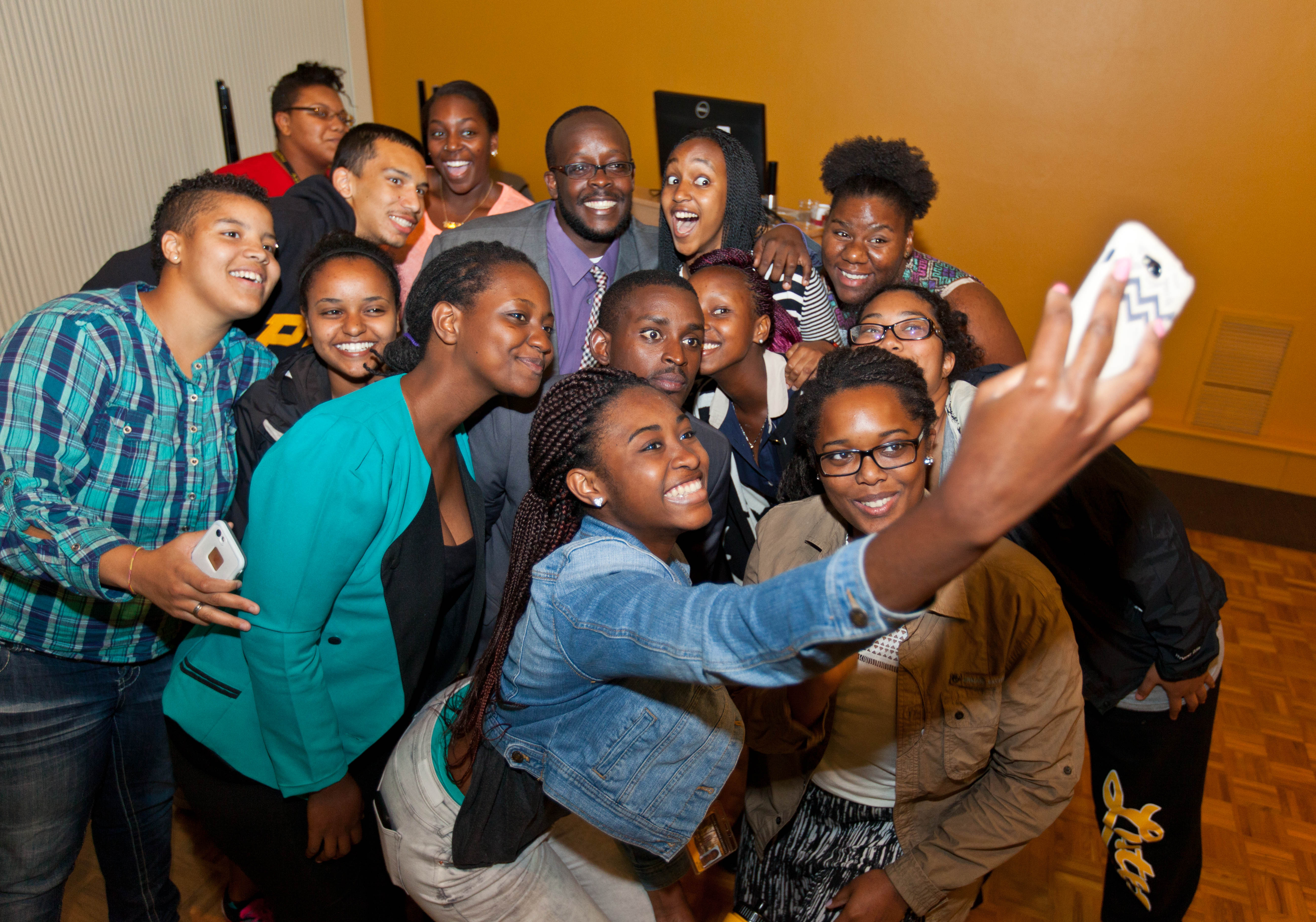 Members of iDebate Rwanda meet students in PLU's Diversity Center.. (Photo: John Froschauer/PLU)