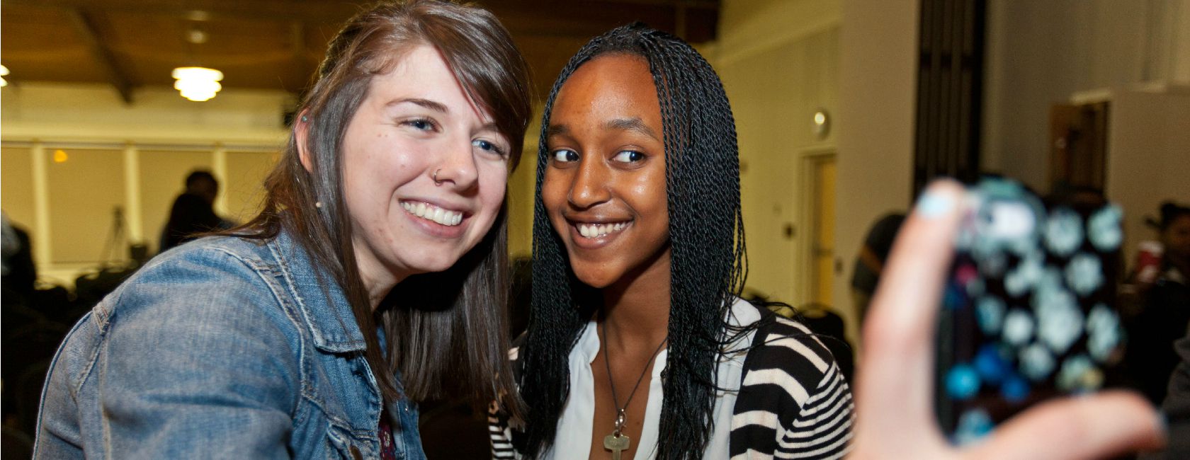 Teresa Hackler '16 takes a selfie with 16-year-old iDebate Rwanda member Maya Musenga. (Photo: John Froschauer/PLU)