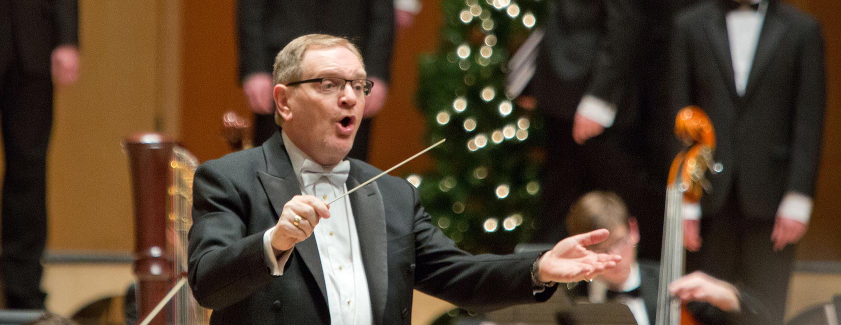 Dr. Richard Nance conducts The Choir of the West at a 2014 PLU Christmas Concert. (PLU Photo/John Froschauer)