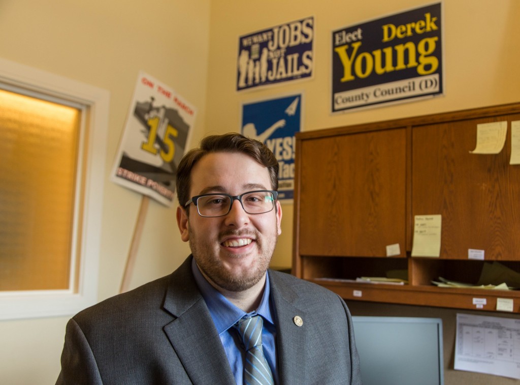 Aaron Sherman '11, Senate Democratic Caucus Communications Specialist in his office, is one of the Lutes in the legislature in Olympia, Washington on Thursday, Feb. 18, 2016. (Photo: John Froschauer/PLU)