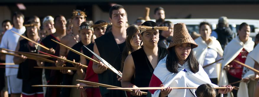 Makah members holding oars