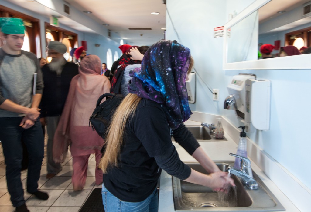 After removing shoes, hand-washing is customary before entering the main shrine of a gurdwara.