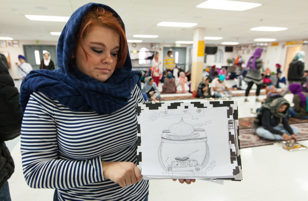 Taking pictures is not allowed in the shrine space of the gurdwara so students are tasked with drawing what they see. MariHa Casas shows her creation.