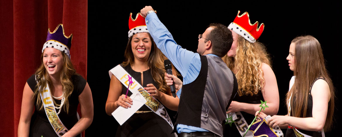 Associate Professor of Religion Antonios Finitsis honors one of the student groups at last year's Hebrew Idol finale event. This year's PLU Hebrew Idol competition has yielded 12 videos, more than ever before. (Photo by John Froschauer)