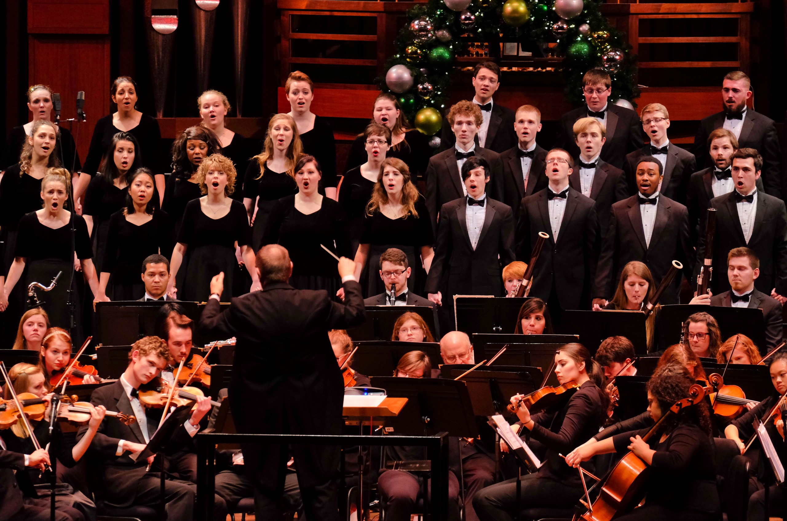 Richard Nance conducting the orchestra and choir