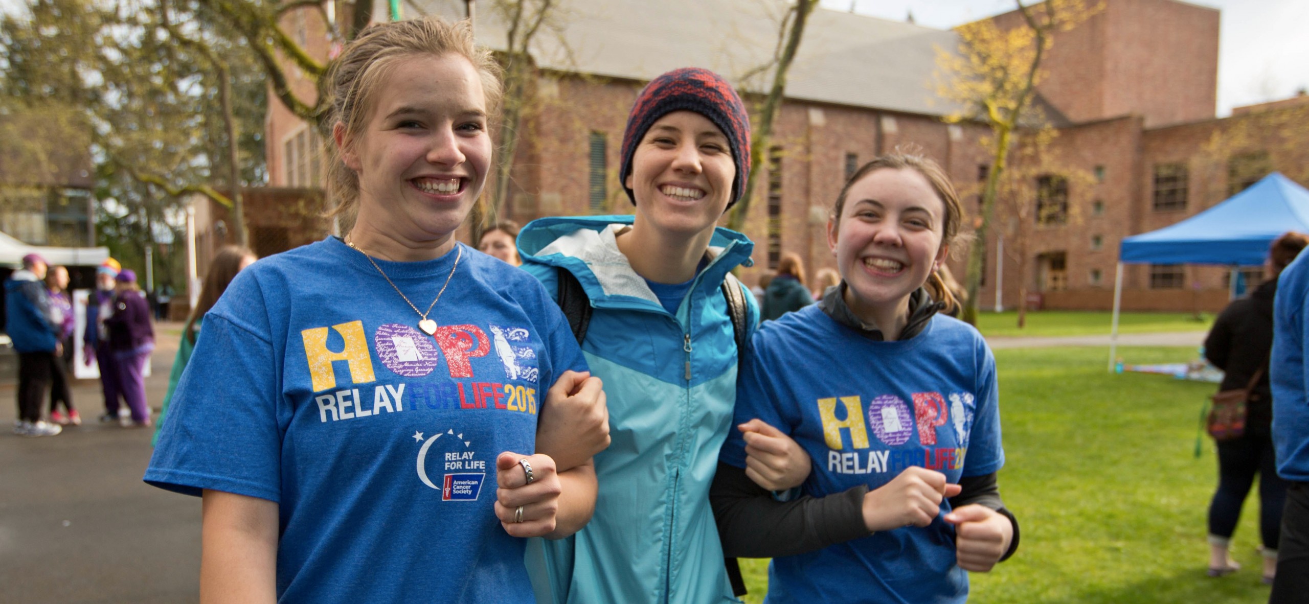 PLU Relay for Life on Friday, April 24, 2015. (Photo: John Froschauer/PLU) Students walking and smiling.