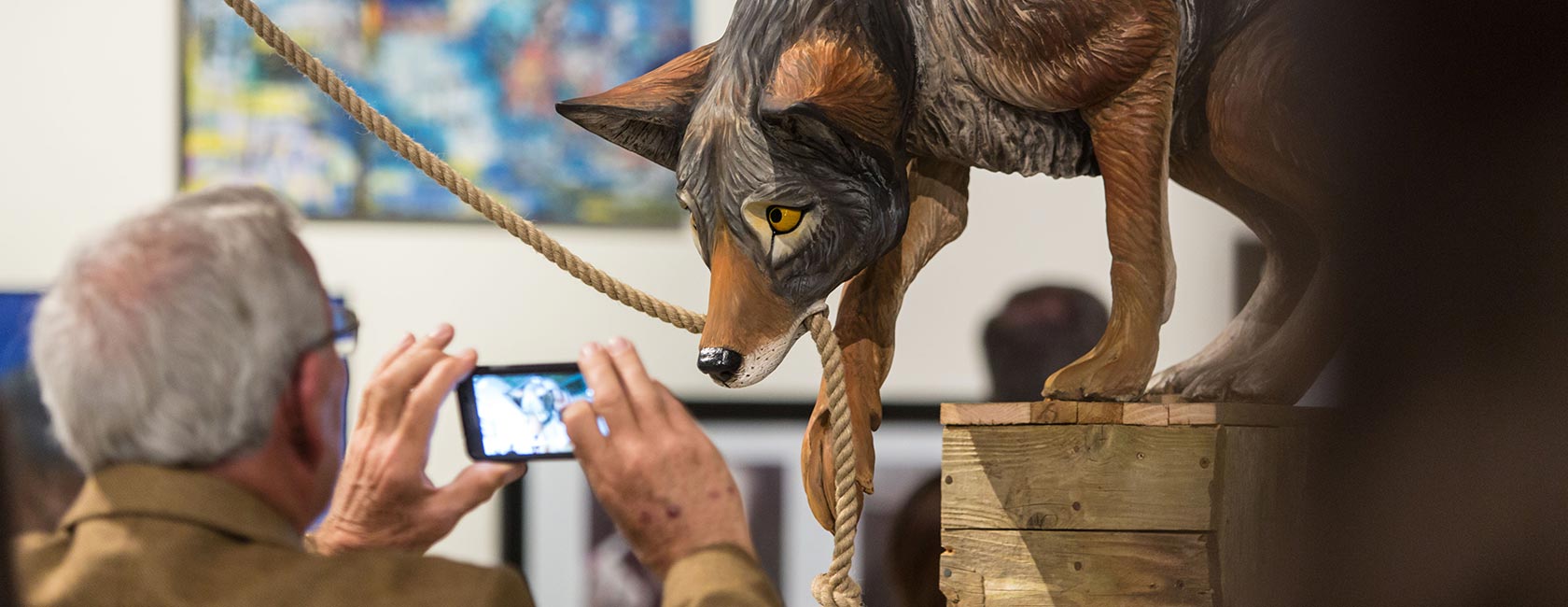 Senior show opening at PLU on on Wednesday, April 20, 2016. (Photo: John Froschauer/PLU) Dog holding rope