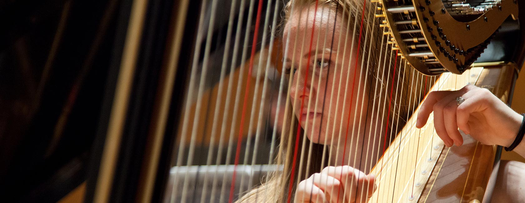 A-member-of-PLU's-2015-wind-ensemble-plays-the-harp
