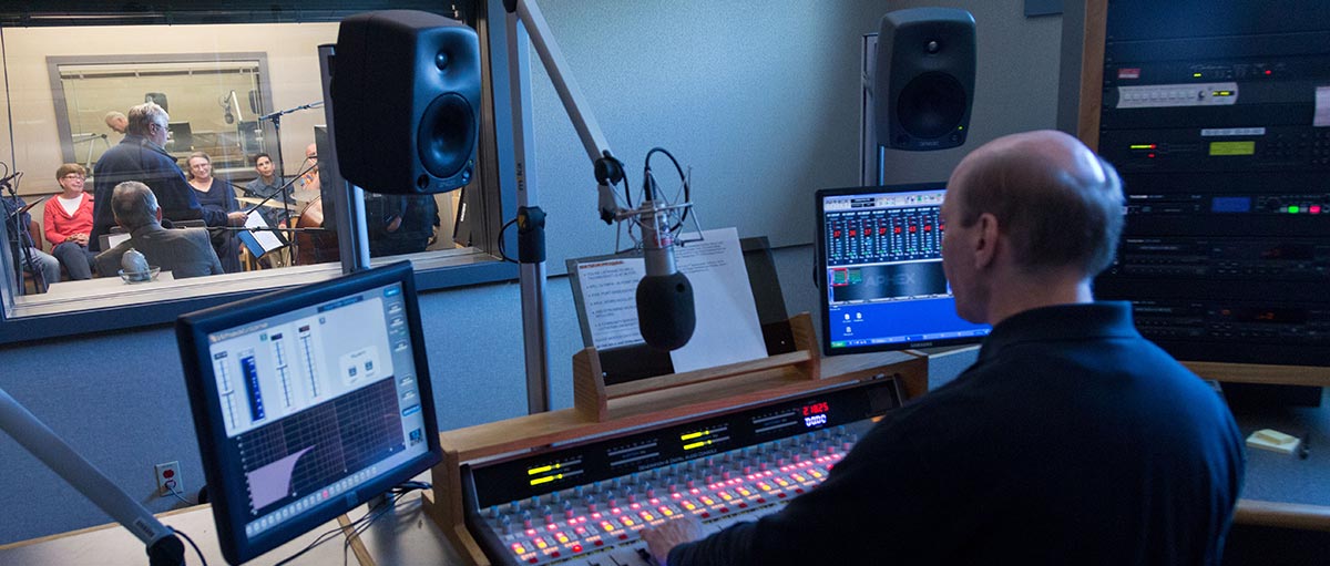 A KPLU audio engineer inside the station's studio at the Neeb Center.