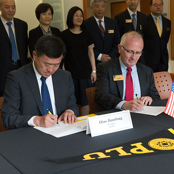 President Allan Belton and representatives from the Shandong Provincial Education Department and Shandong Foreign Trade Vocational College in China