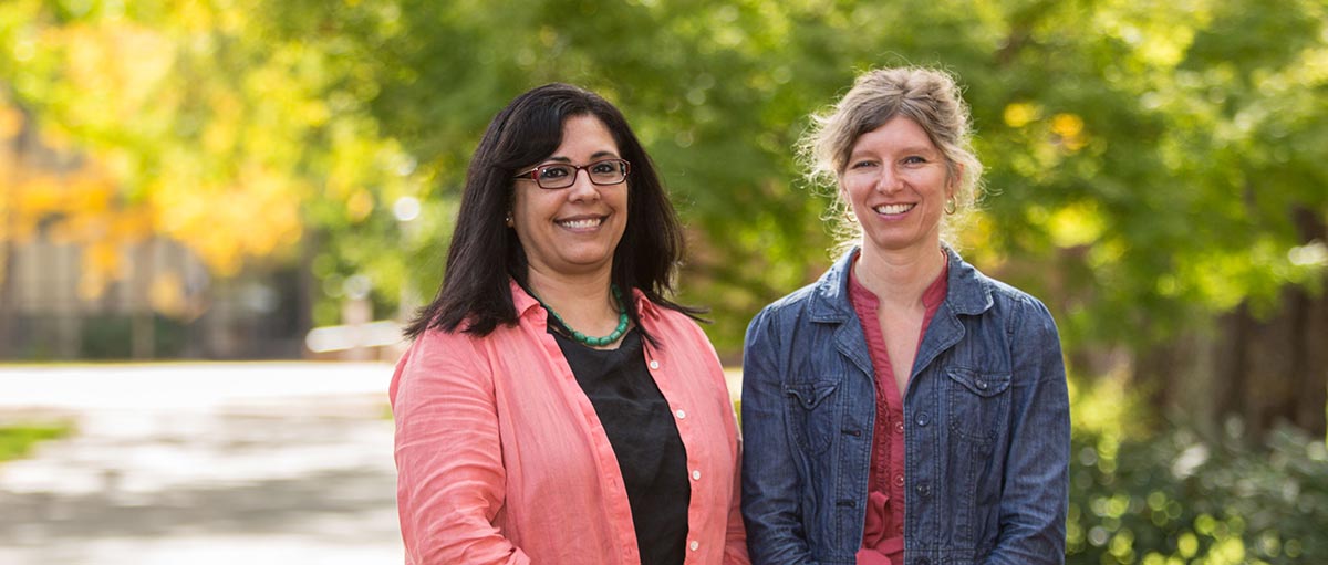 PLU professors Giovanna Urdangarain (left) and Rebecca Wilkin