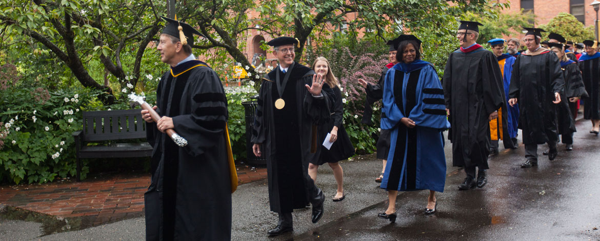PLU President Thomas W. Krise, Provost Rae Linda Brown and other faculty and administrators proceed through campus ahead of the annual convocation ceremony. (Photo by John Froschauer/PLU)
