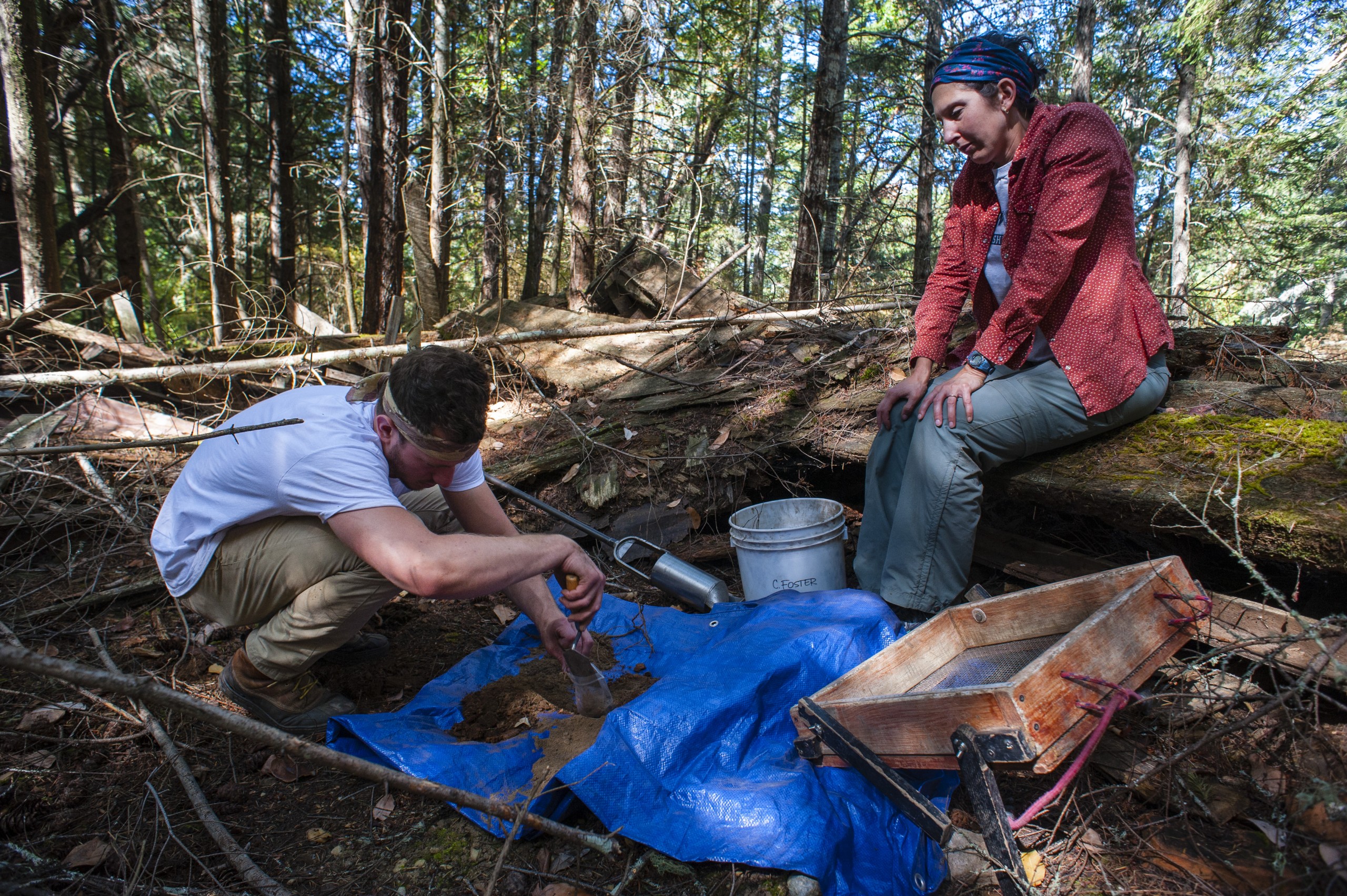 Grant Schroeder '17 taking an auger sample inside the homestead. (Photo by Ted Charles '12)