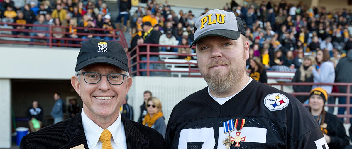 PLU President Thomas W. Krise and PLU Vet Corps Navigator Sgt. Steve Shumaker '16 at the 2014 PLU Military Appreciation Football Game.