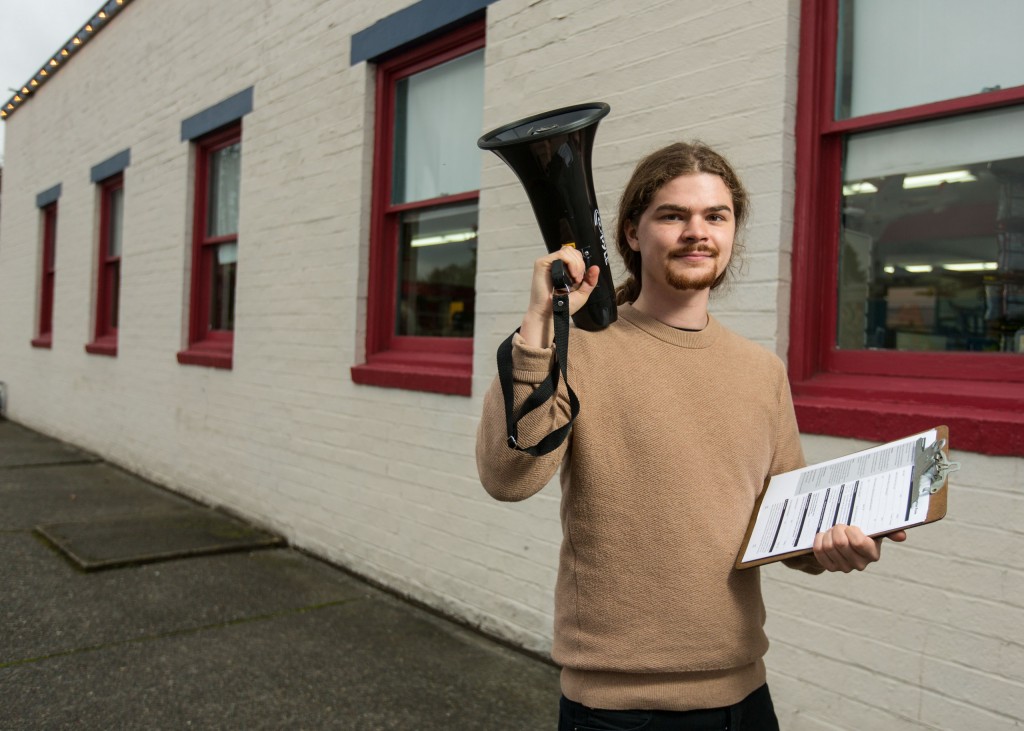 Austin Beiermann '18 with a megaphone and clipboard