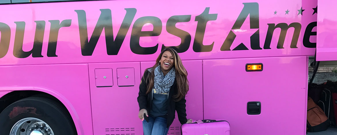 Kiana Norman-Slack '17 stands in front of the Choir of the West tour bus during the Southwest tour in January. (Photo courtesy of Norman-Slack)