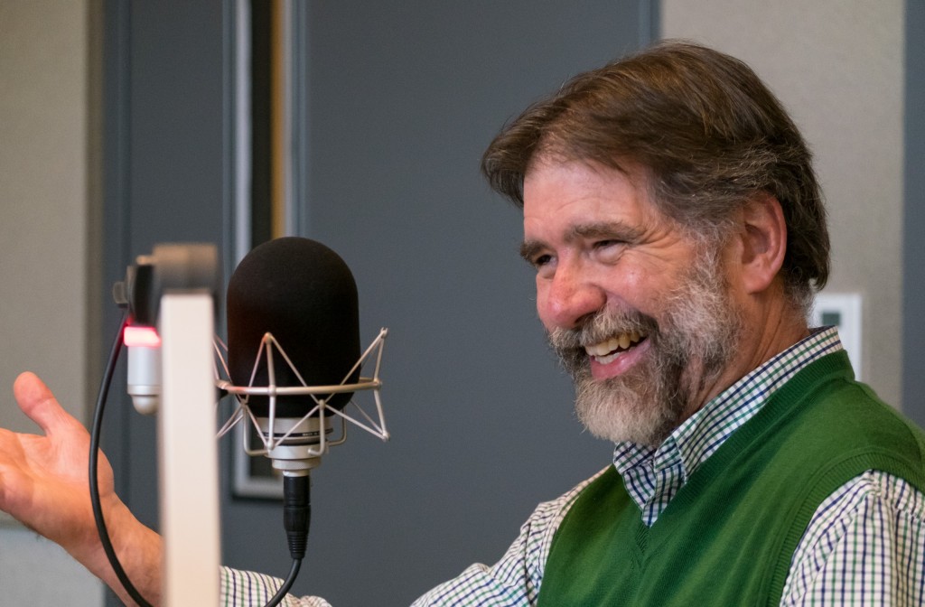 David R. Huelsbeck laughs while recording his episode of DCHAT.