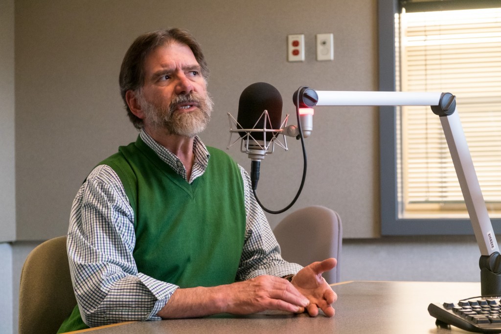 David R. Huelsbeck, PLU Dean of Social Sciences, recording DCHAT in the KNKX studio on campus at PLU.