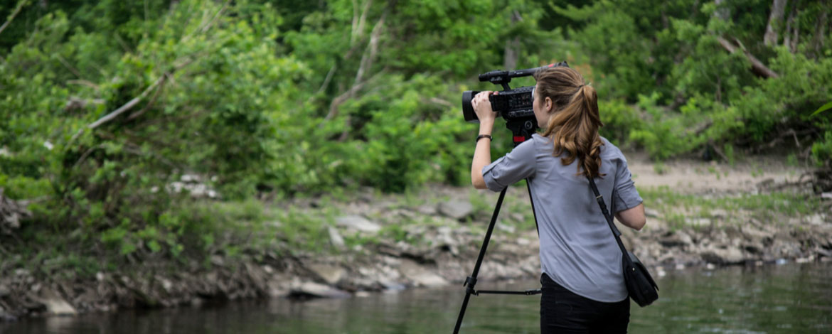 Rachel Lovrovich '18, general manager of MediaLab and creative director for "Changing Currents," films at the Connecticut River. (Photo courtesy of MediaLab)