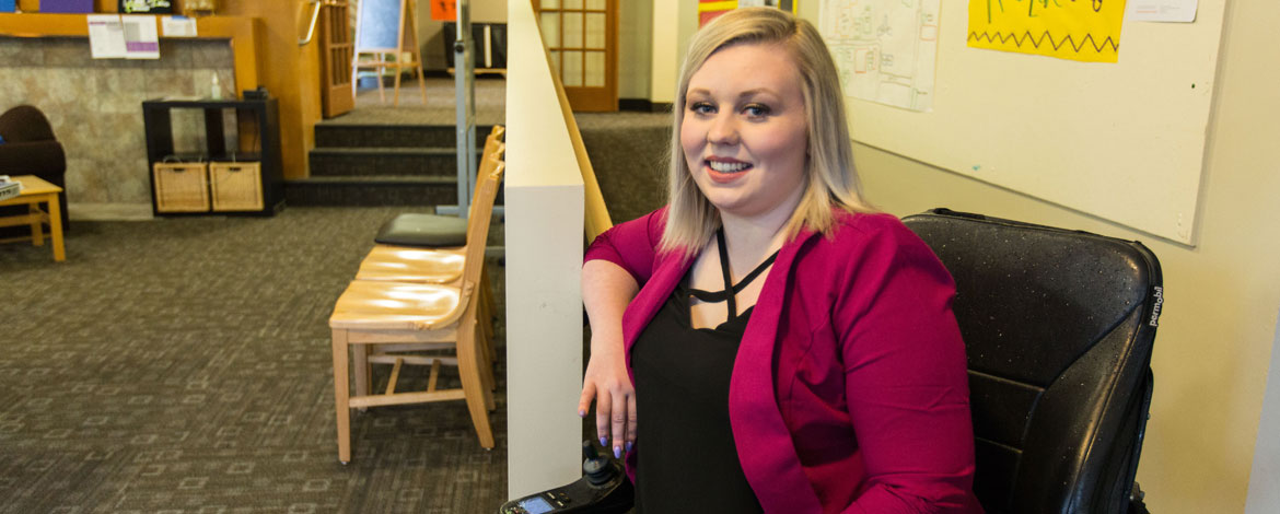 Noelle Green '18 has been a vocal advocate for accessibility on PLU's campus. She is pictured above on a new ramp in the Kreidler Hall lounge. (Photo by John Froschauer/PLU)