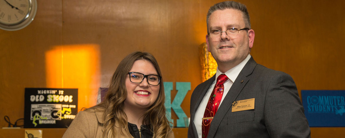 Katie Dean ’21 accepts the Red Feather Endowed Scholarship from Michael Farnum, director of military outreach at PLU. Dean is the first to accept the award, which honors Native American students who exhibit great pride in their heritage. (Photo by John Froschauer/PLU)