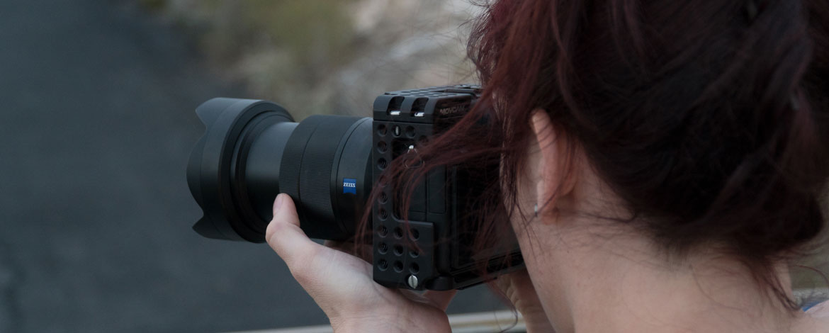 Mackenzie Cooper '19 shoots photos on location during filming for MediaLab's newest documentary series, "A World of Difference." (Photo courtesy of MediaLab)