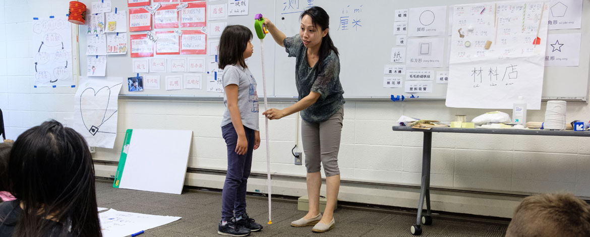 Native Korean and Chinese speakers learn how to teach lessons in their respective languages through the STARTALK program, a grant-funded program that came to PLU's campus this year for the first time in the 11-year partnership with Seattle Public Schools. (Photos by John Froschauer/PLU)