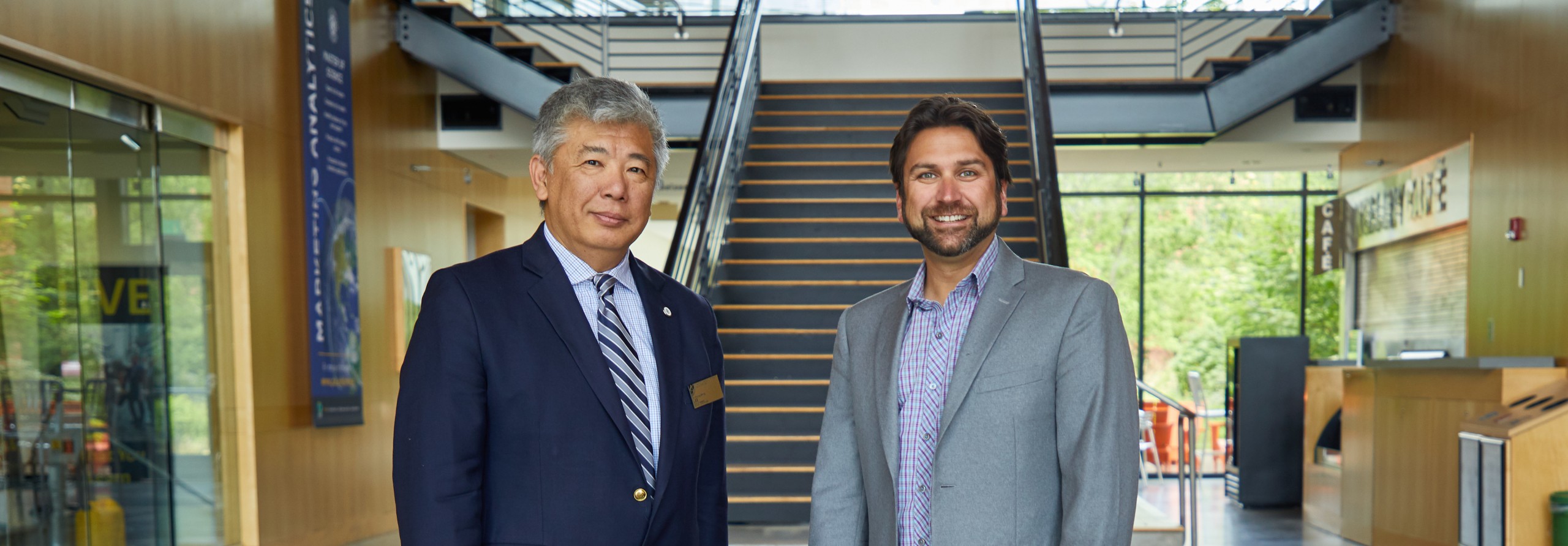 Justin Foster '02, and School of Business Dean Chung-Shing Lee photographed in and around Morken at at PLU.